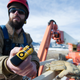 NREL researcher Jason Roadman shows the tracking device (Photo: Dennis Schroeder/National Renewable Energy Lab)